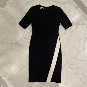 Wisp black knee-length sheath dress with mini-slit